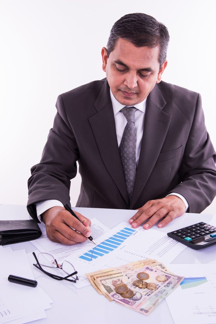 india-accounting-concept-showing-accountant-working-income-tax-forms-budget-planning-with-currency-notes-calculator-house-car-3d-models_466689-12359